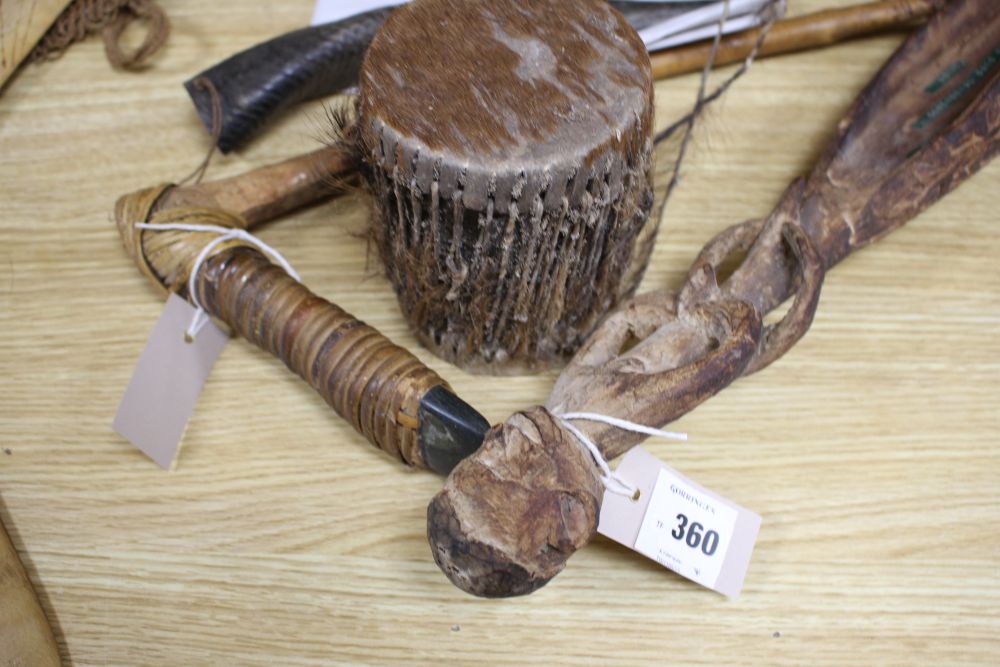 An Asmat Regency, Papua carved wood figural ceremonial sago bowl and various other tribal artifacts,